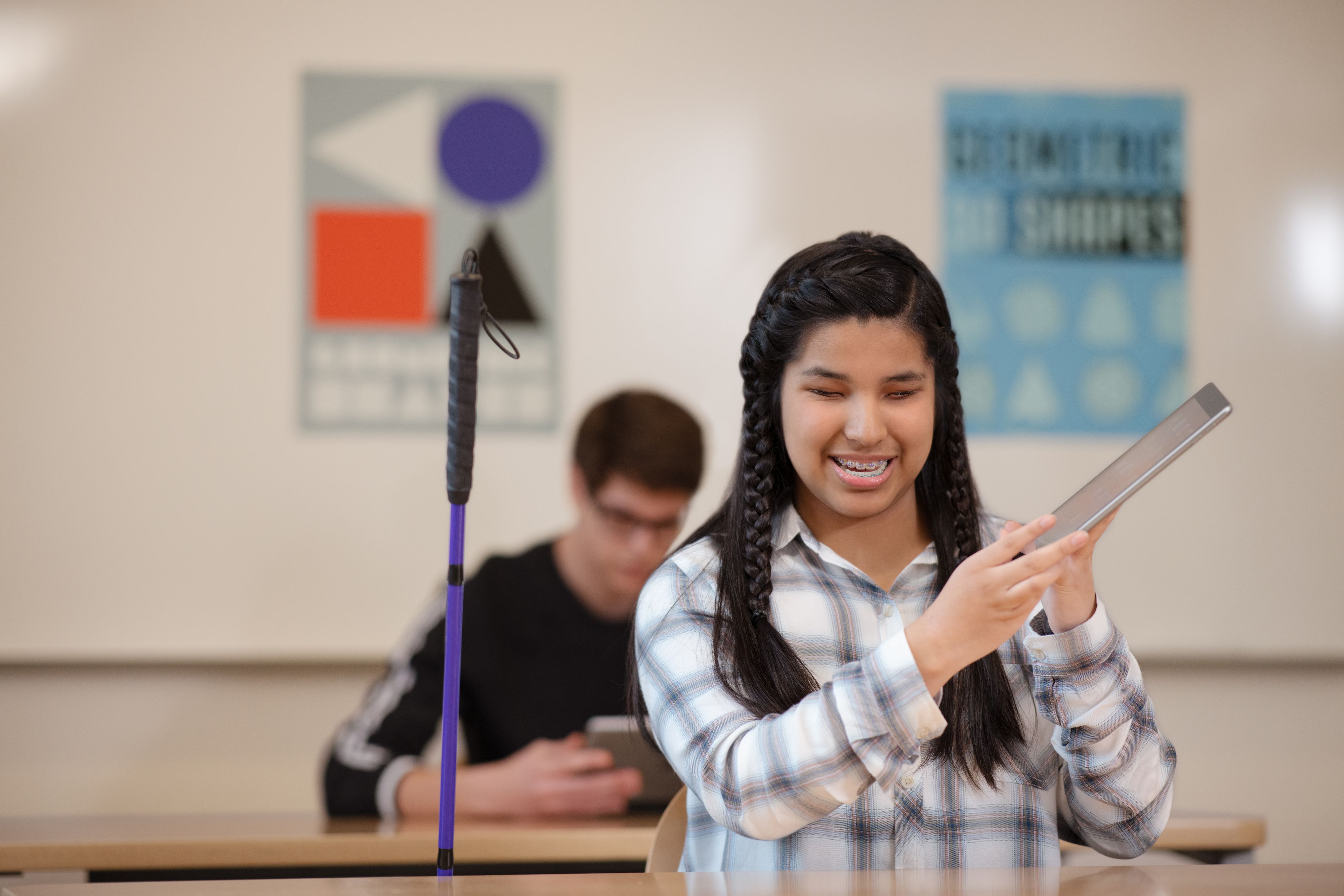 Student using Accessibility features on an Apple Education device in the classroom